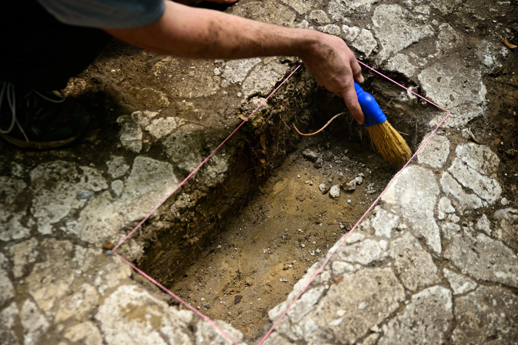 A researcher excavates the tabby floor at the Miller site. Credit: Patrick Hall