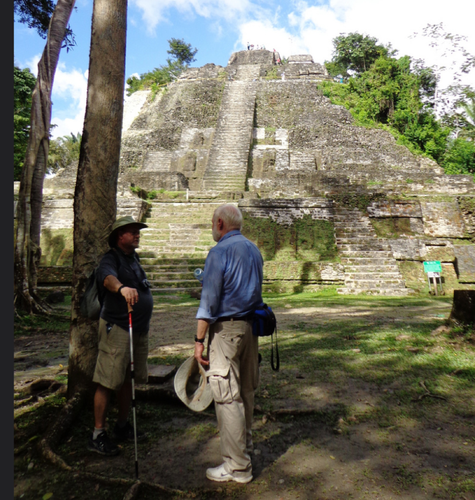 Professor Henderson Discussing with Tour participant at Lamanai, Belize. Photo Courtesy John Henderson.