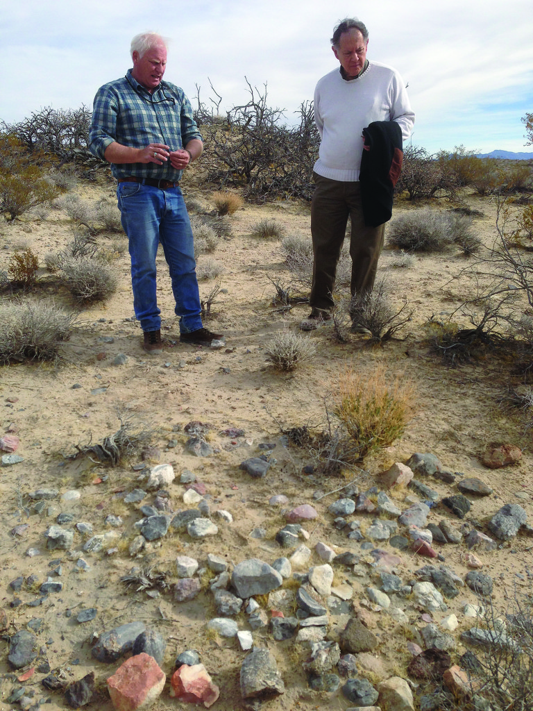 Mark Boatwright and John Wiley, the son of Roland Wiley, stand by a hearth-like feature.